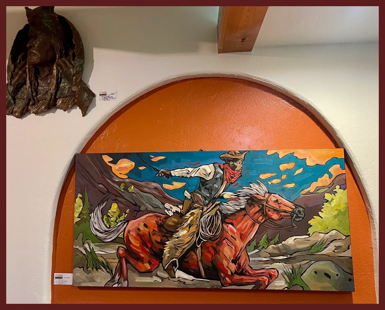 Colorful cowboy painting on display