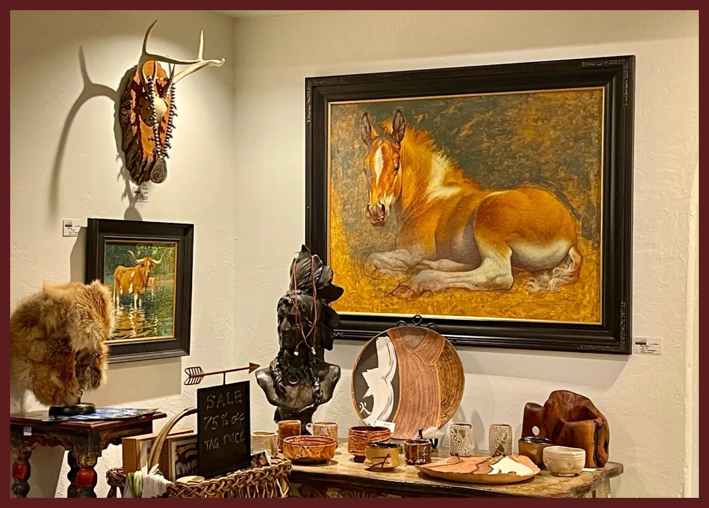 Art gallery with horse-themed decor