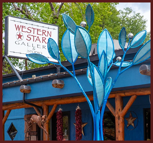 Blue metal leaf sculpture outside Western Star Gallery