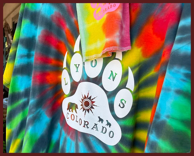 Tie-dye shirt with Lyons, Colorado paw logo
