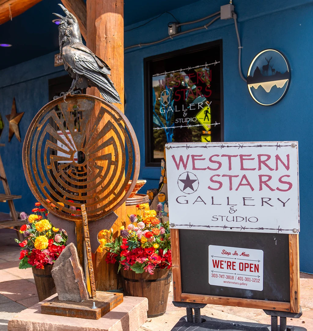 Western Stars Gallery sign with raven sculpture
